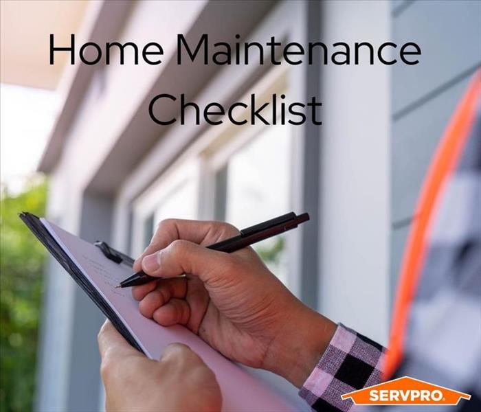 Homeowner making a list of maintenance items