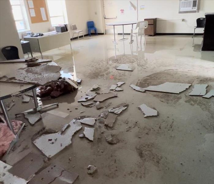 Water damage causing flooding and fallen ceiling tiles due to burst pipes in Clinton, SC 