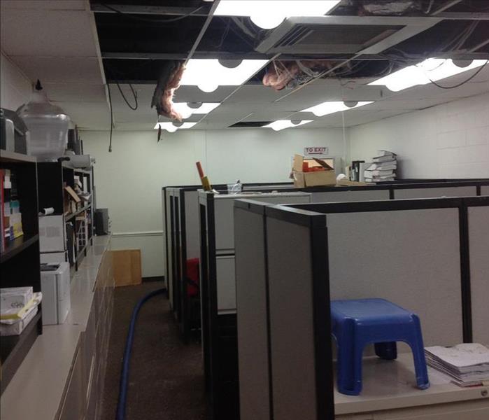 Commercial Business that experienced roof and water damage from a storm. SERVPRO is extracting water from the business