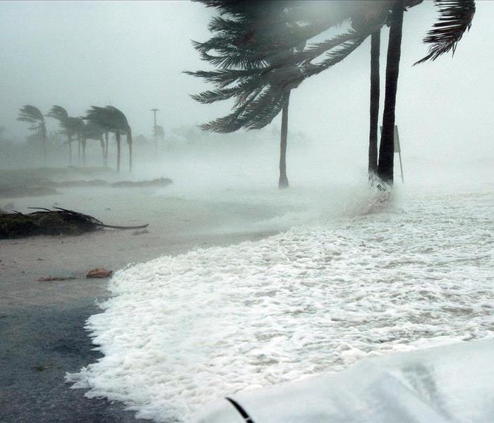 A hurricane with high winds hitting the coast