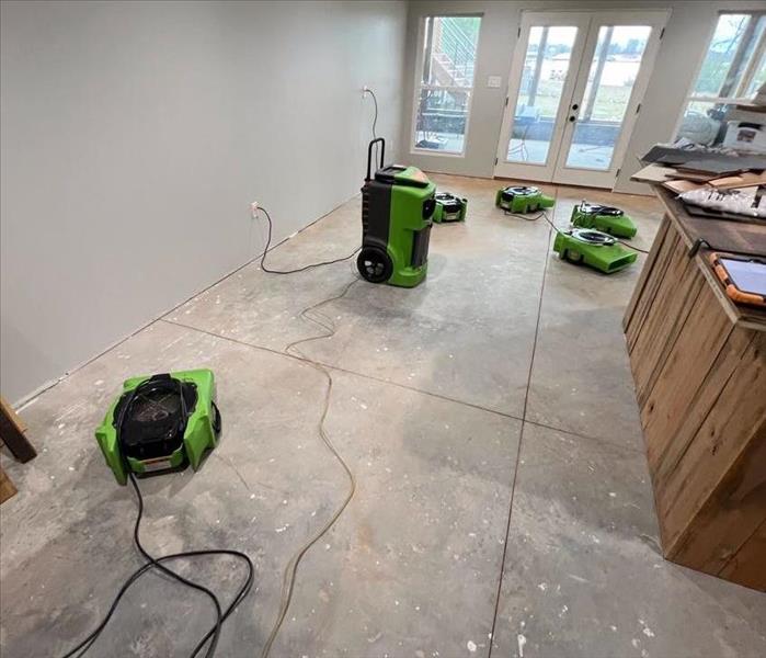 SERVPRO drying units drying out a water damaged floor