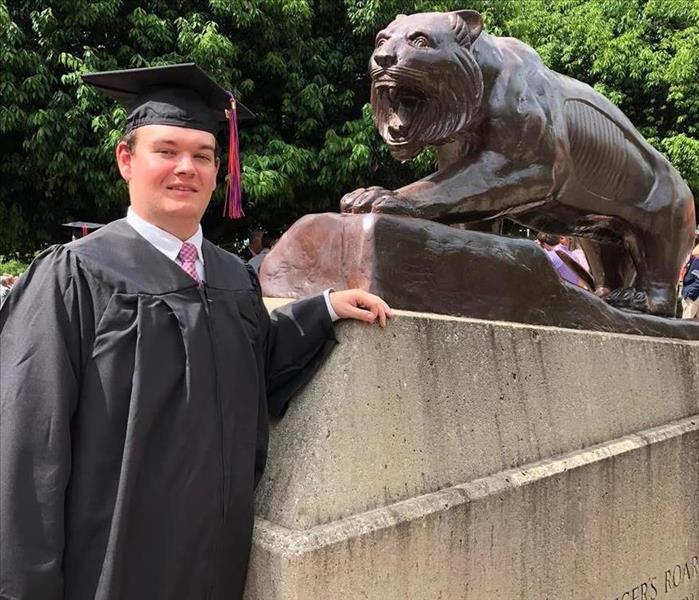Graduate Griffin Lewis standing by the Clemson Tiger