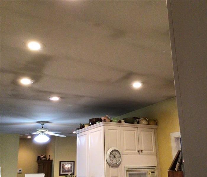 Soot fire cleaning of the ceiling of a home 