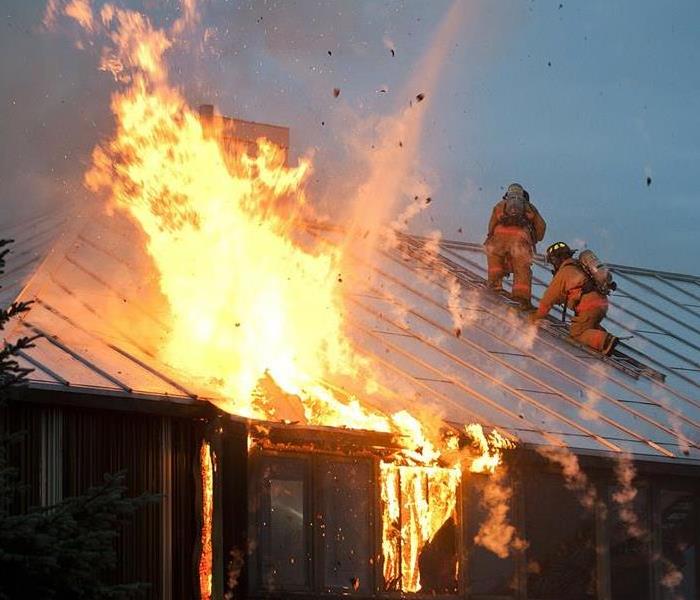 Firefighters putting out a house fire